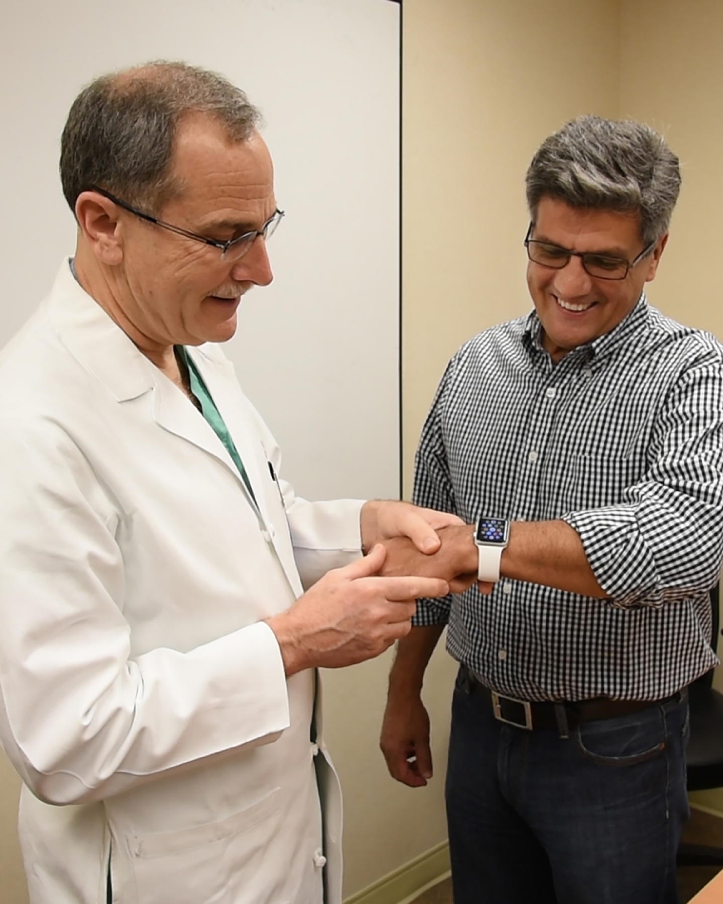 Dr. Richard Milani with patient using Apple Watch